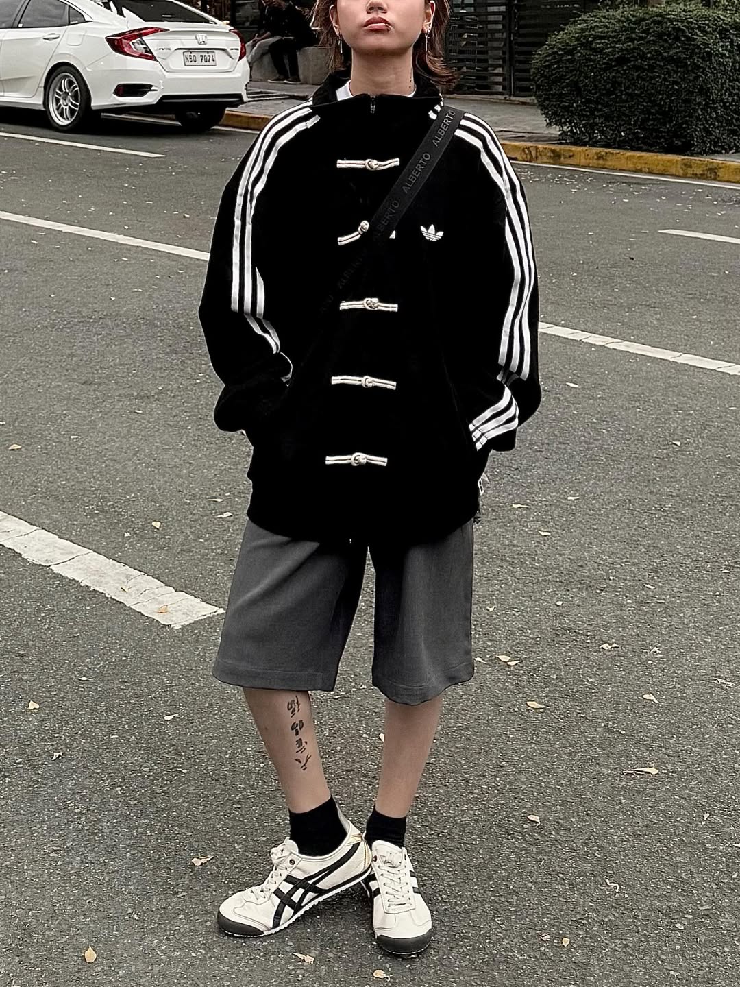 Black CNY Jackets streetwear design with white sleeve stripes and high collar