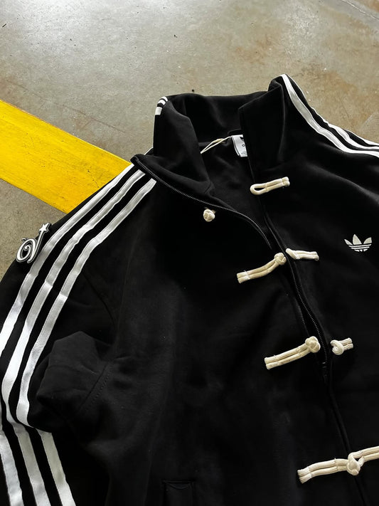 Close-up of Black CNY Jacket showing Chinese knot buttons and premium fabric